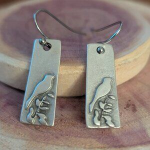 LIL BIRD EARRINGS: Antique silver-plated lil bird on a branch earrings.